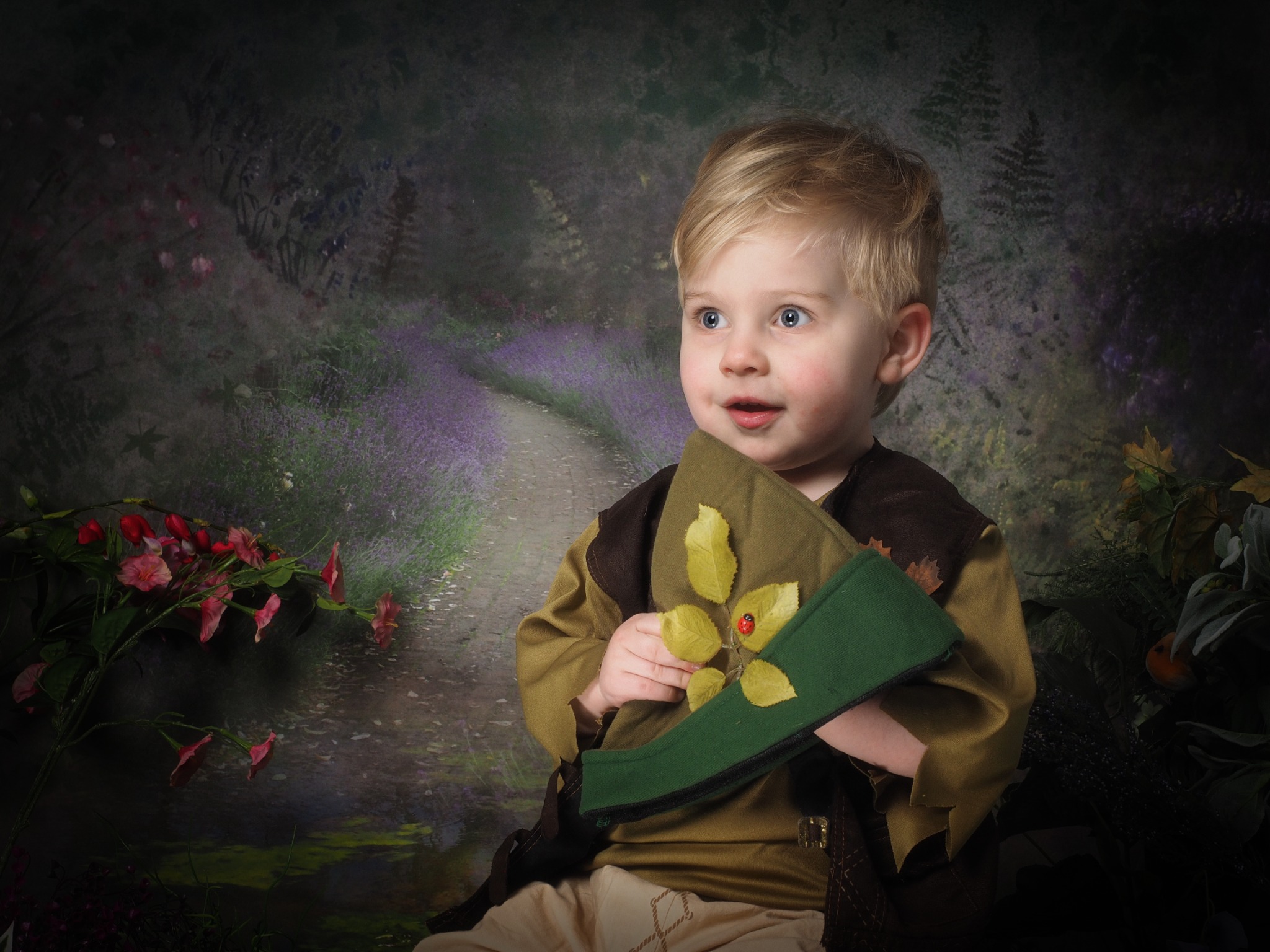 A young child in a woodland costume
